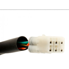 A close-up image of a multi-colored wiring harness adapter with various loom plugs for motorcycle lighting.